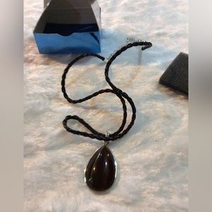 Woman’s cats eye on cord necklace by Avon